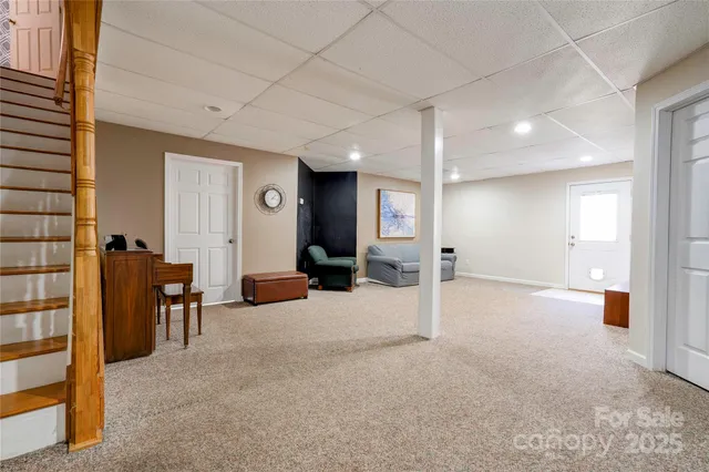 a view of a livingroom with furniture and a chandelier