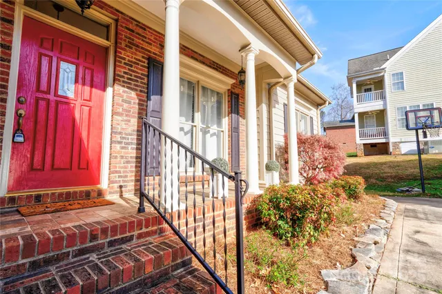a view of a house with a small yard
