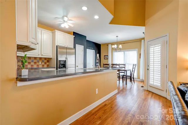 a view of a kitchen with furniture and a large window