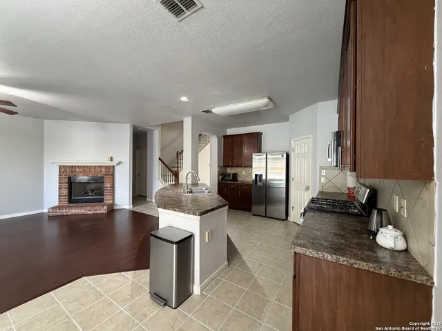 a kitchen with granite countertop lots of counter top space