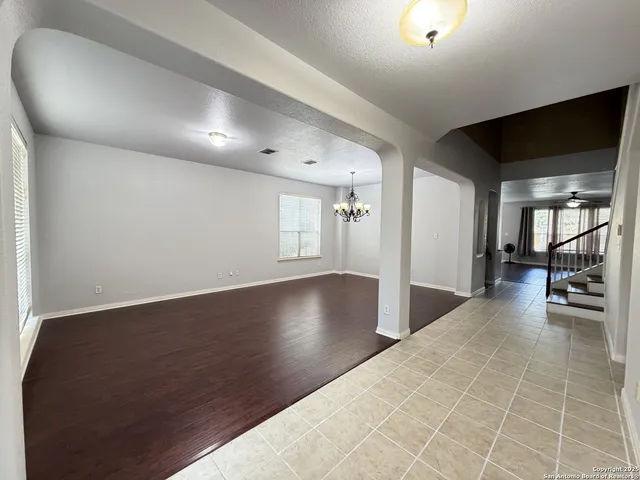 wooden floor in a hall with a living room