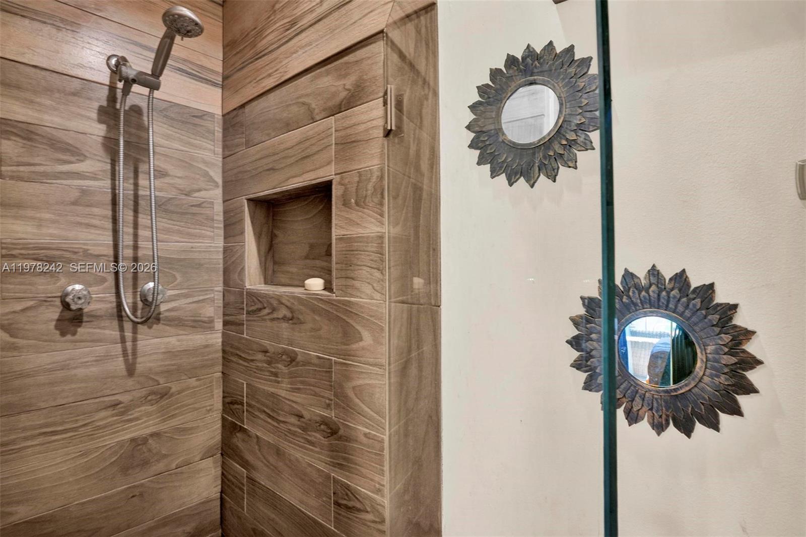 812 Chukker Road, Unit 4 Delray Beach, FL 33483 - Photo 3 of 10 a bathroom with a shower and mirror