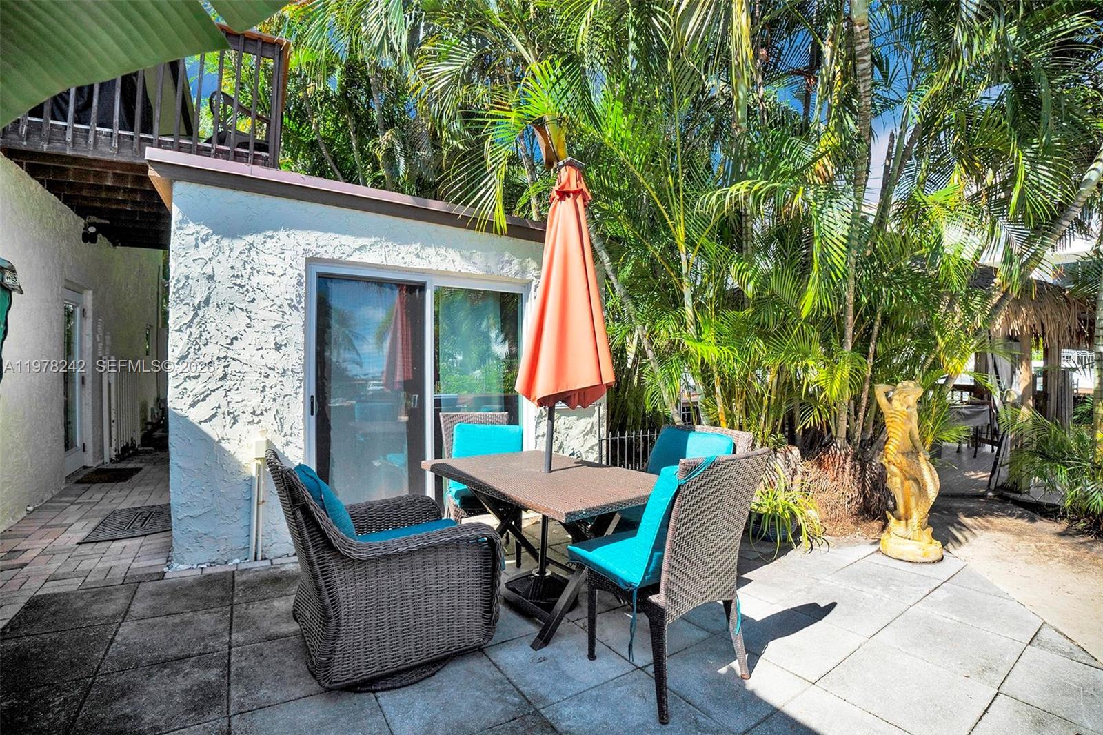 812 Chukker Road, Unit 4 Delray Beach, FL 33483 - Photo 5 of 10 a view of a house with backyard and sitting area