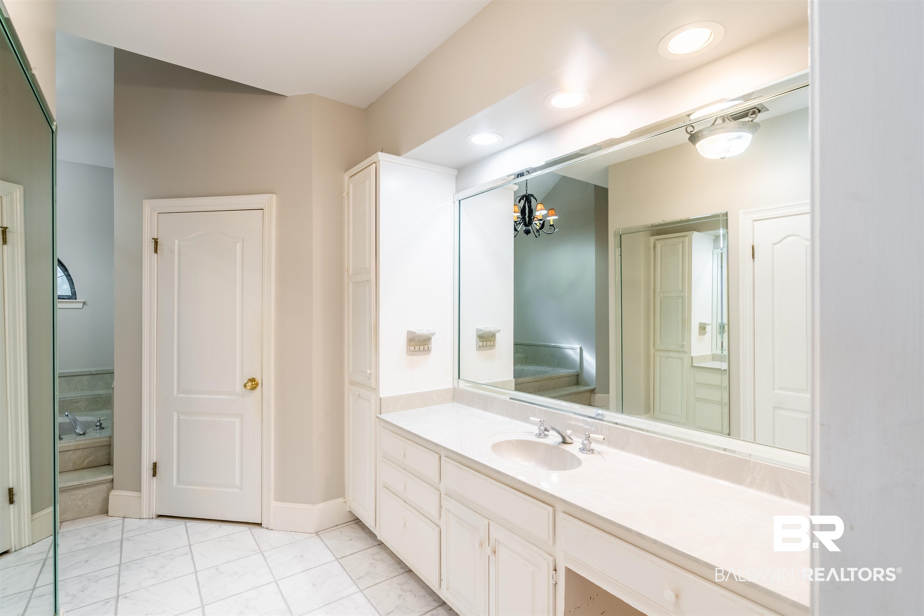 3821 St Andrews Loop East Mobile, AL 36693 - Photo 28 of 41 Bathroom featuring vanity and a notable chandelier