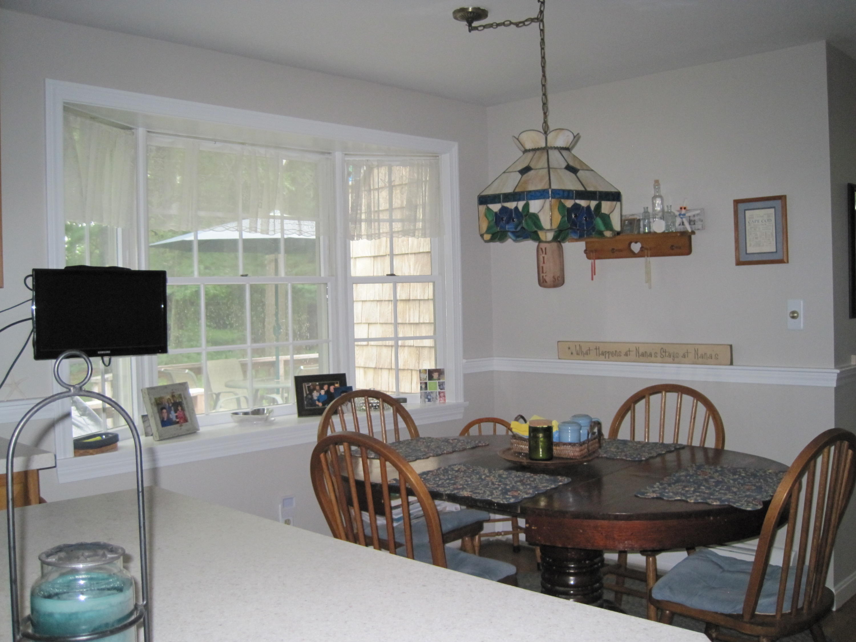 40 Lumbert Mill Road Centerville, MA 02632 - Photo 9 of 31 a living room with furniture a flat screen tv and a window