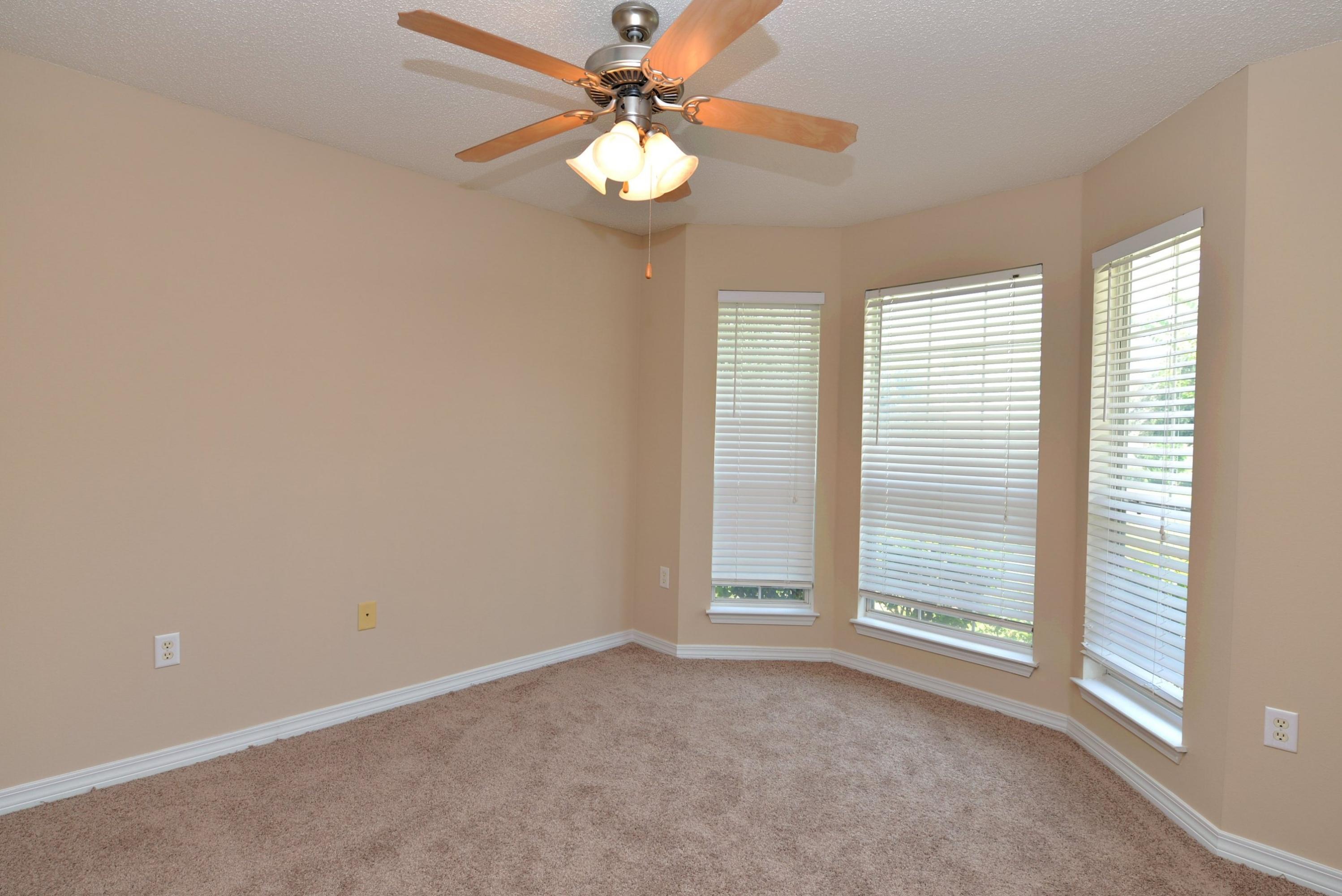 68 South Harborview Road Santa Rosa Beach, FL 32459 - Photo 14 of 26 an empty room with windows and fan
