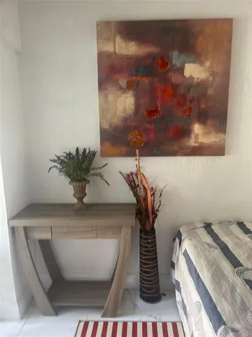 a vase of flowers sitting on a table