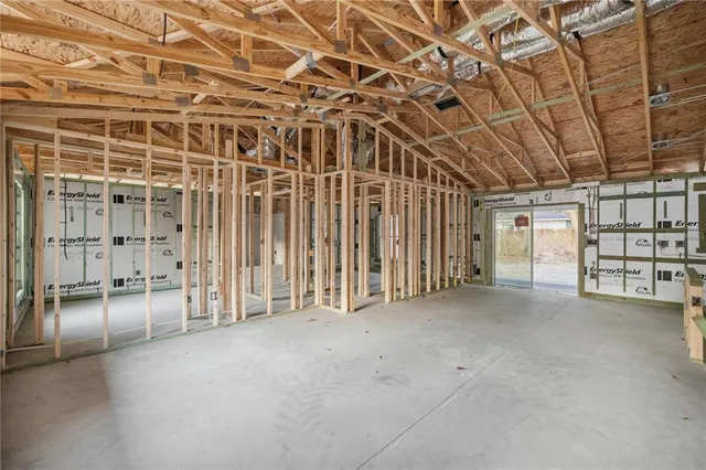 a view of an empty room with a staircase
