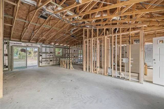 a view of an empty room with wooden walls