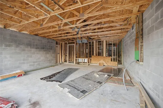a view of a patio with table and chairs and potted plants