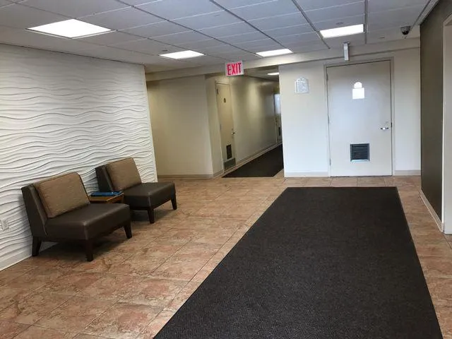 a view of a livingroom with furniture and a ceiling fan