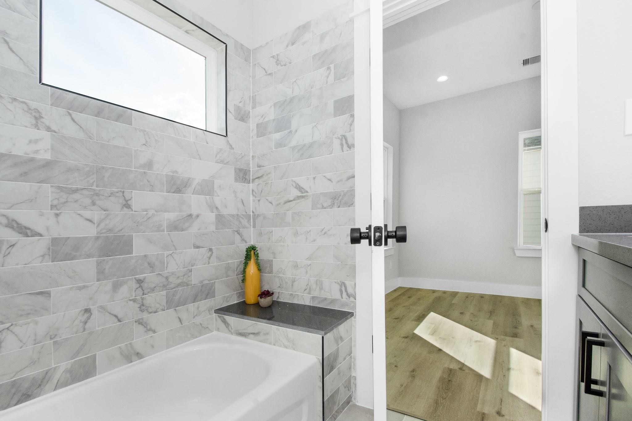2105 Sam Wilson Street, Unit A Houston, TX 77020 - Photo 14 of 20 a bathroom with a sink and a bathtub