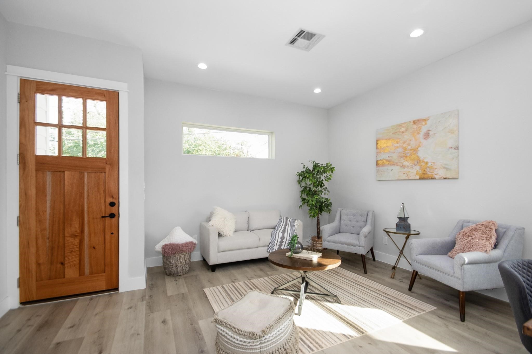 2105 Sam Wilson Street, Unit A Houston, TX 77020 - Photo 3 of 20 a living room with furniture and a window