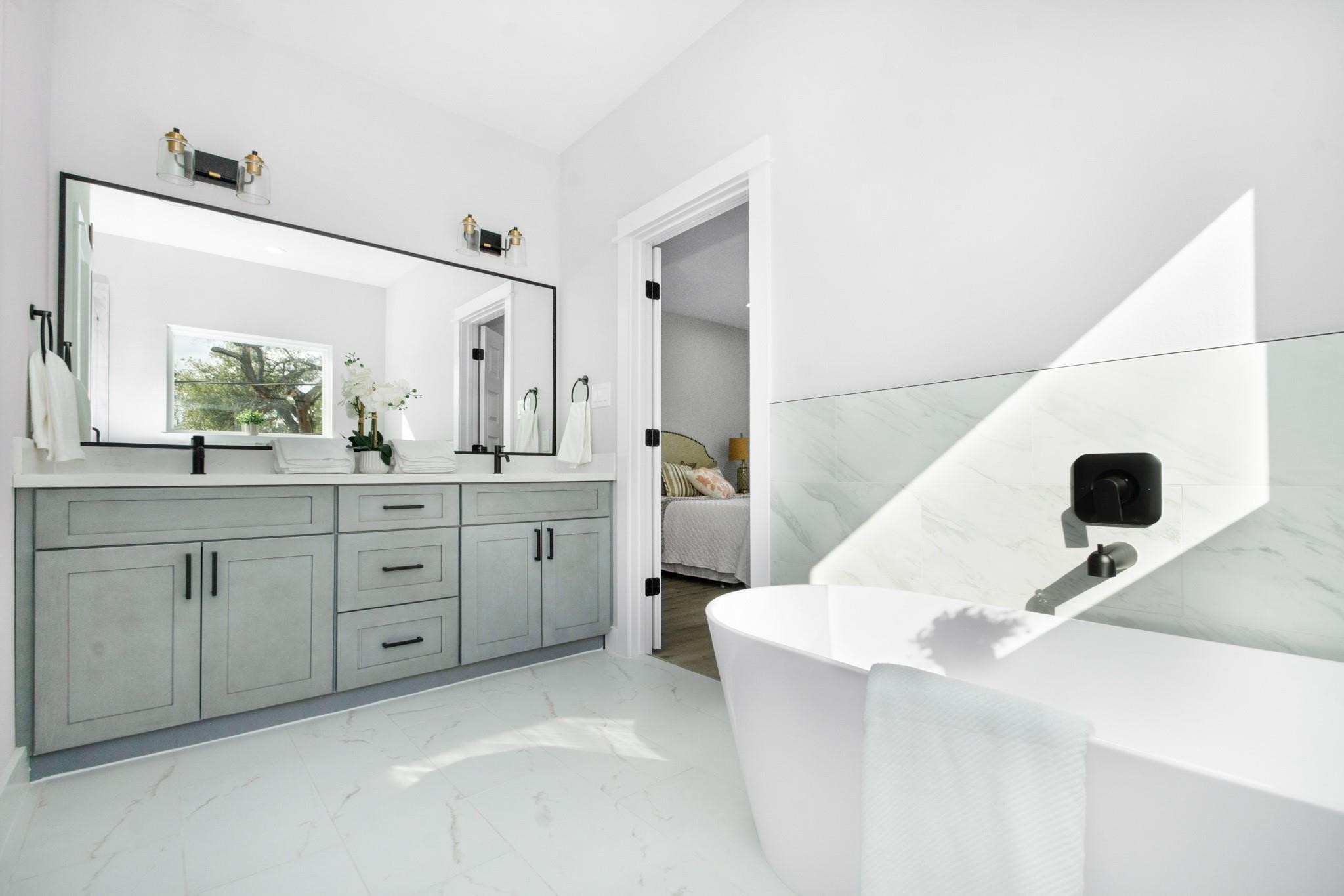 2105 Sam Wilson Street, Unit A Houston, TX 77020 - Photo 7 of 20 a spacious bathroom with a sink and a mirror