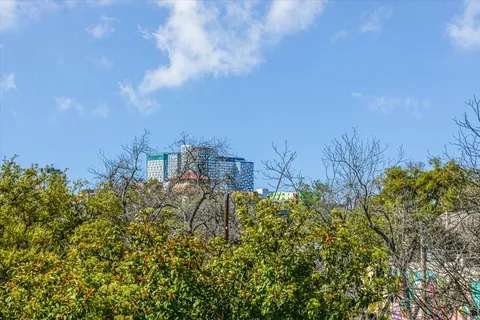 a view of a house with swimming pool and sitting area