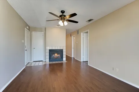 a view of a hallway with wooden shelves