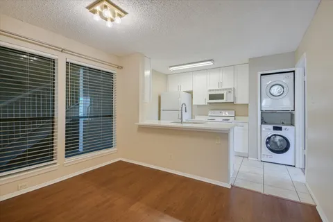 a kitchen with a sink stove and refrigerator