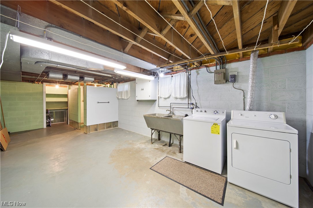 6835 Lake Road East Madison, OH 44057 - Photo 22 of 25 Lower level laundry and shower/ toilet / wash basin.