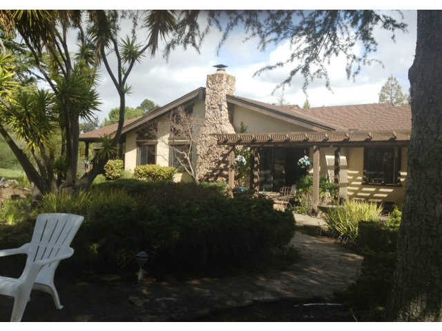 351 Ridgeway Road Woodside, CA 94062 - Photo 4 of 19 a view of backyard of house with garden and trees
