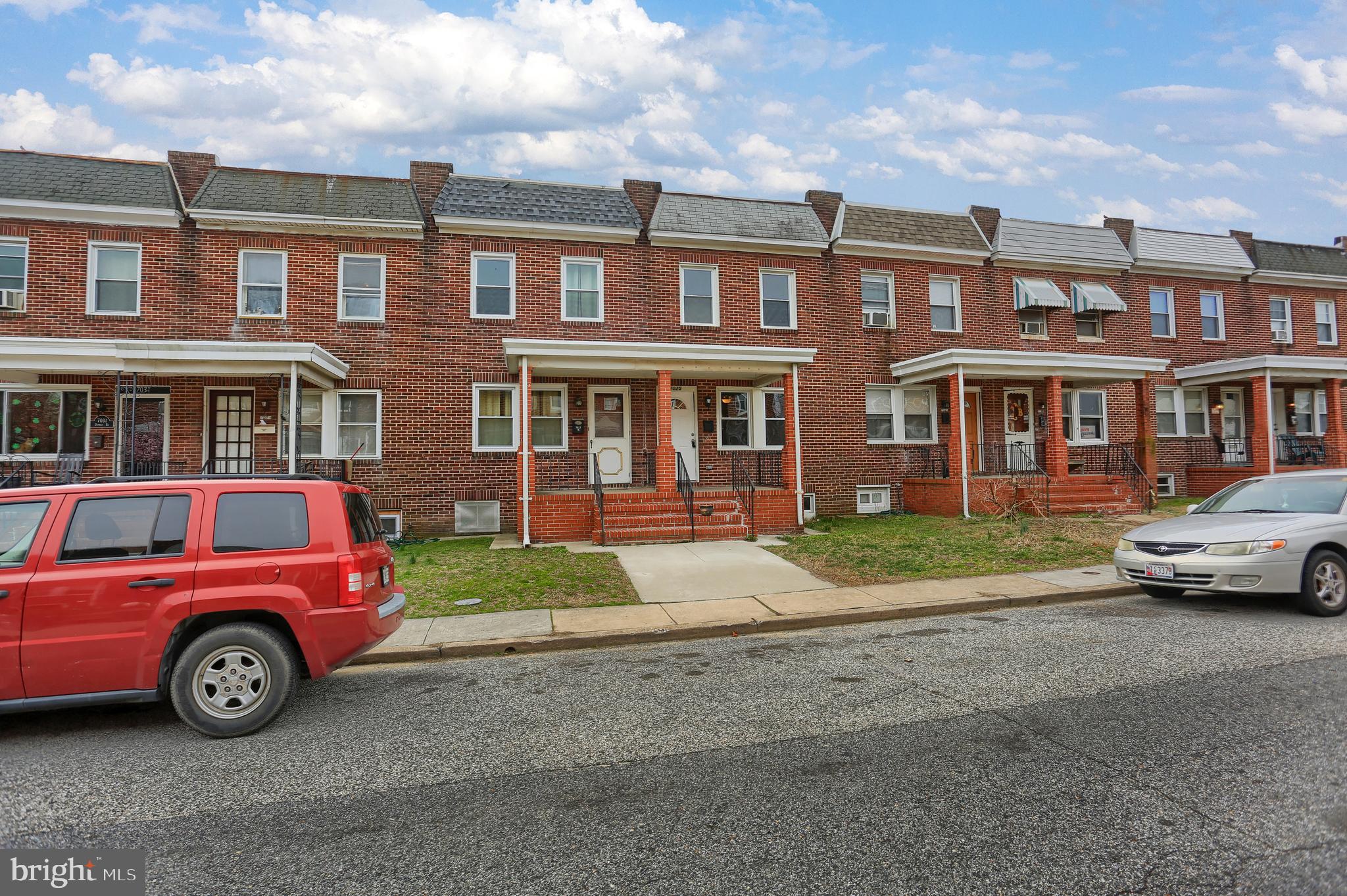 7025 Dunbar Road Dundalk, MD 21222 - Photo 2 of 27 a car parked in front of a house