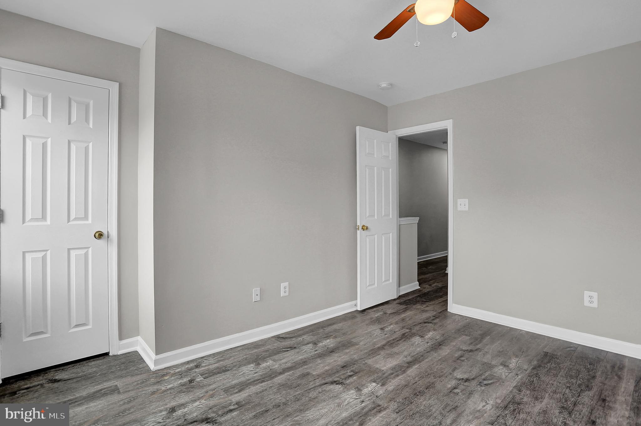 7025 Dunbar Road Dundalk, MD 21222 - Photo 18 of 27 wooden floor in an empty room