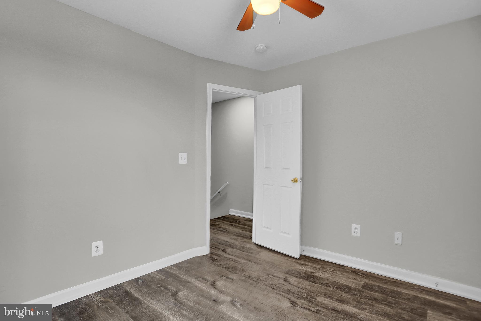 7025 Dunbar Road Dundalk, MD 21222 - Photo 21 of 27 wooden floor in an empty room