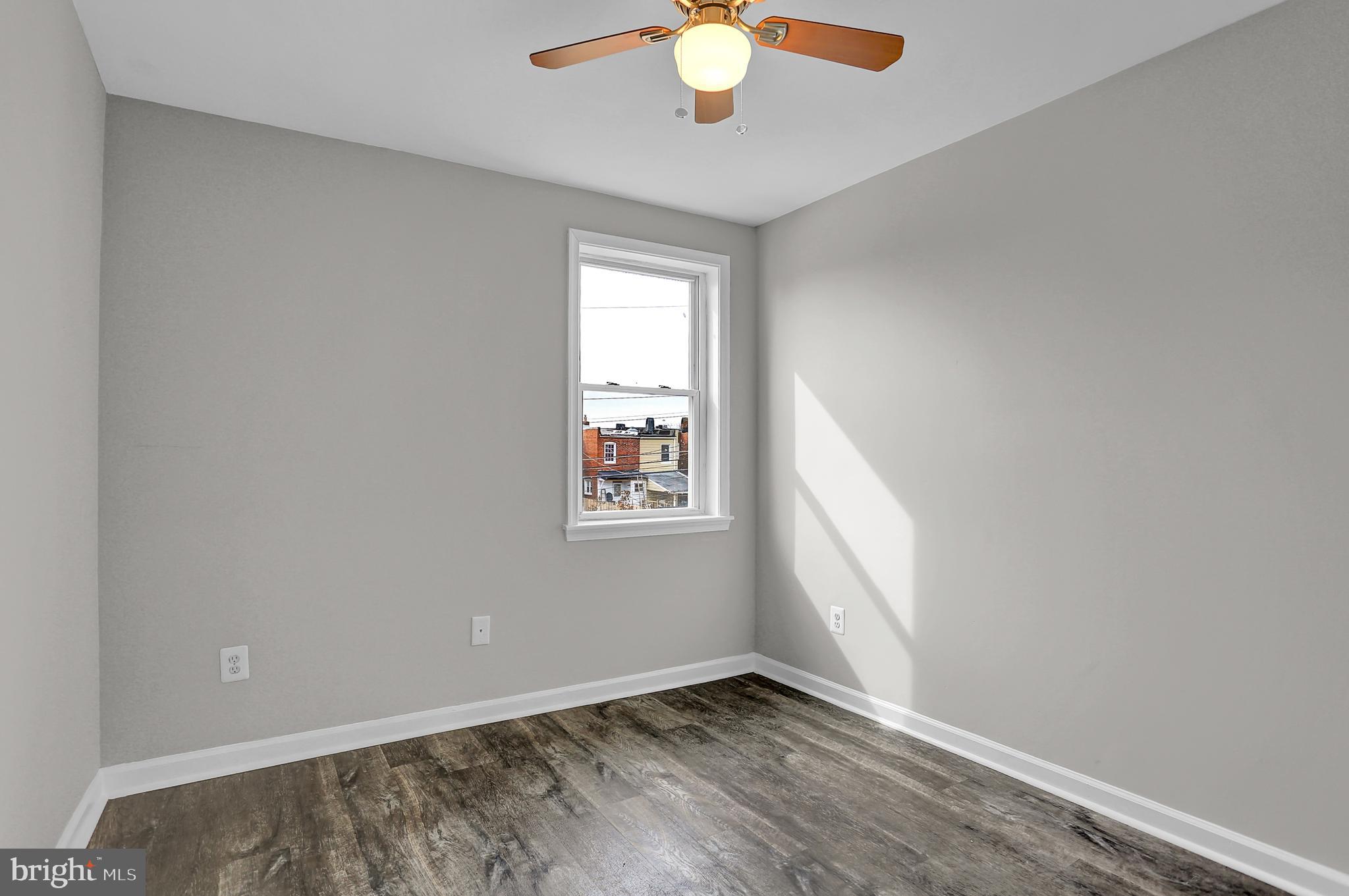 7025 Dunbar Road Dundalk, MD 21222 - Photo 22 of 27 an empty room with a window