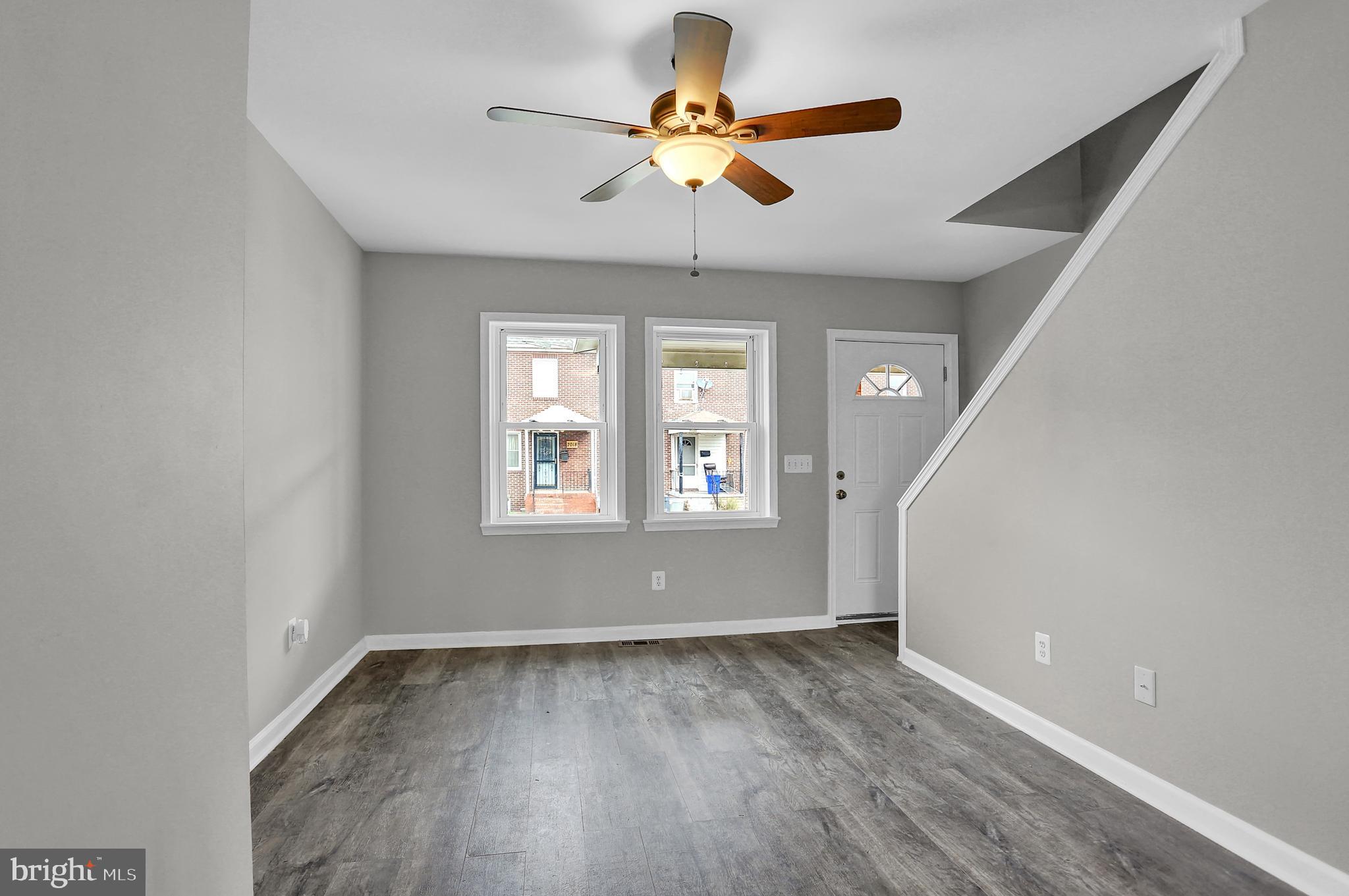 7025 Dunbar Road Dundalk, MD 21222 - Photo 6 of 27 a view of an empty room with a window
