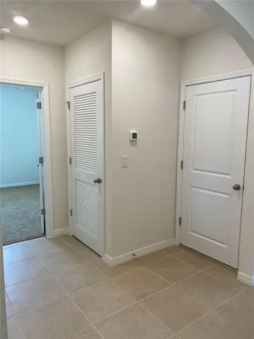 an empty room with closet area
