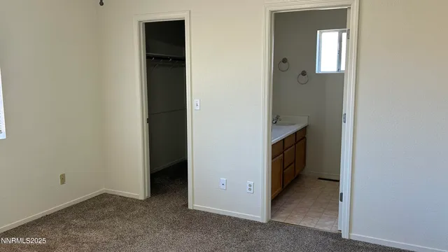 a bathroom with a sink vanity and tub