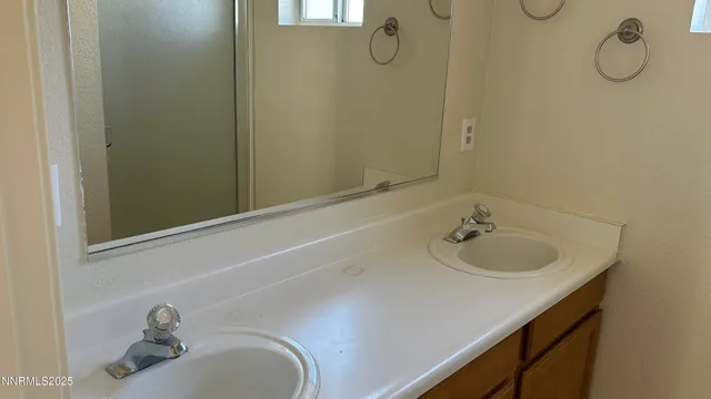 a bathroom with a shower and a sink