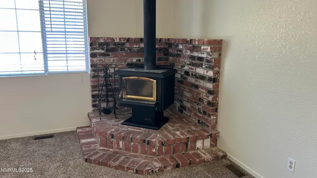 a view of a livingroom with a fireplace