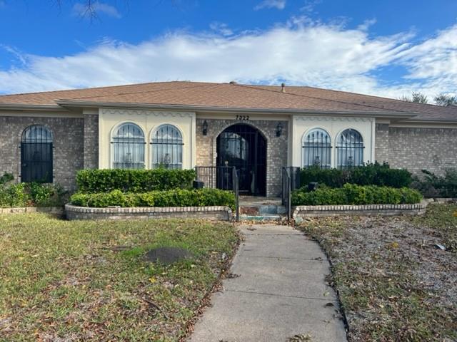 7322 Hunnicut Road Dallas, TX 75227 - Photo 1 of 1 a front view of a house with yard and green space