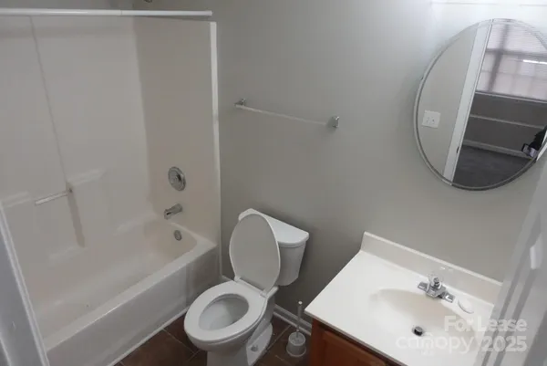 a bathroom with a toilet a sink and bathtub