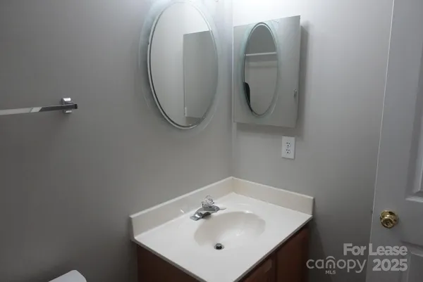 a bathroom with a sink and mirror