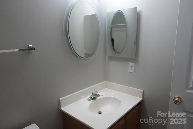 a bathroom with a sink and mirror