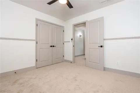 an empty room with ceiling fan
