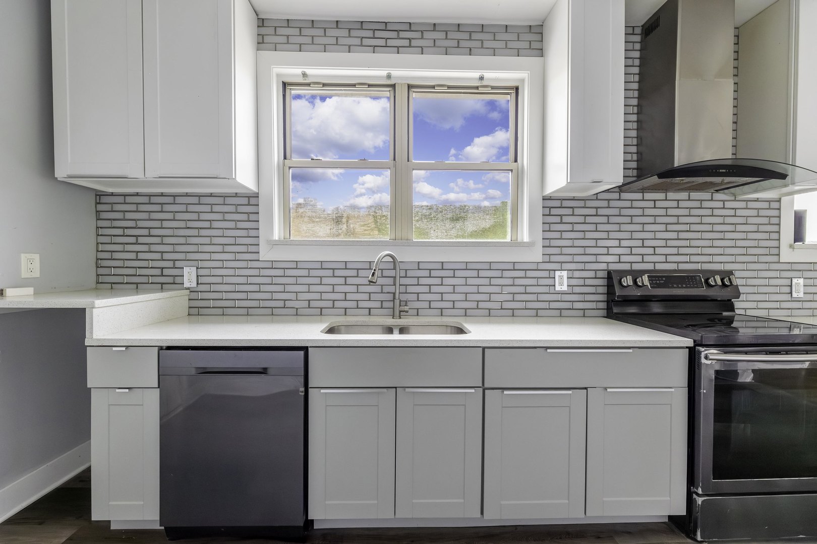 7759 South Constance Avenue Chicago, IL 60649 - Photo 14 of 26 a kitchen with a sink cabinets and window