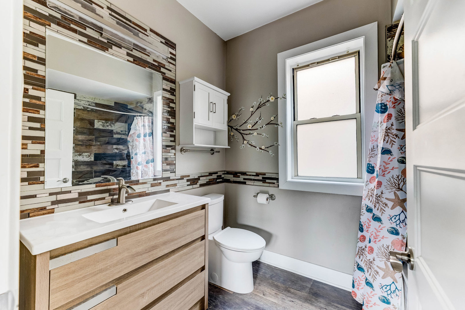 7759 South Constance Avenue Chicago, IL 60649 - Photo 19 of 26 a bathroom with a sink toilet and shower