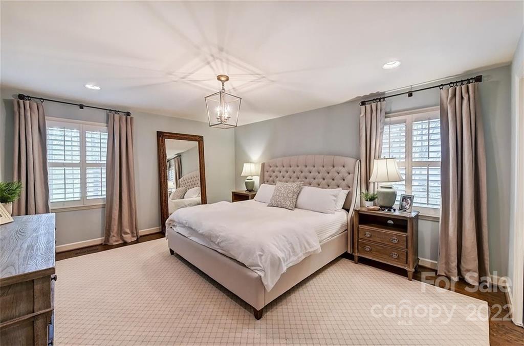 4023 Columbine Circle Charlotte, NC 28211 - Photo 22 of 35 a bedroom with a large bed and a window