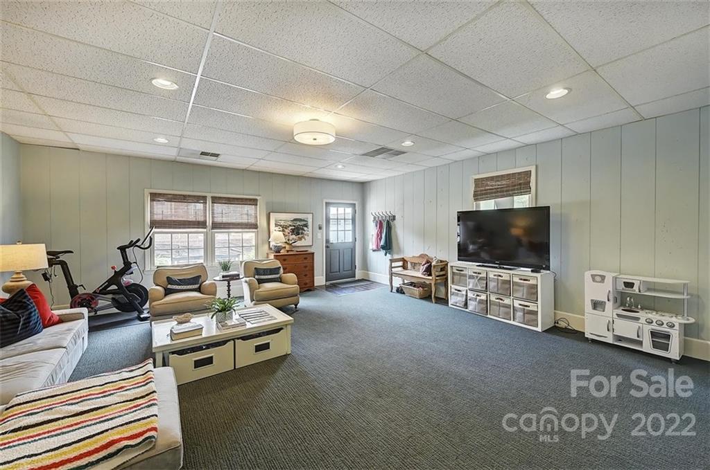 4023 Columbine Circle Charlotte, NC 28211 - Photo 25 of 35 a living room with furniture and a flat screen tv