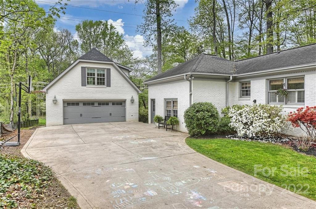 4023 Columbine Circle Charlotte, NC 28211 - Photo 31 of 35 a front view of a house with a garden