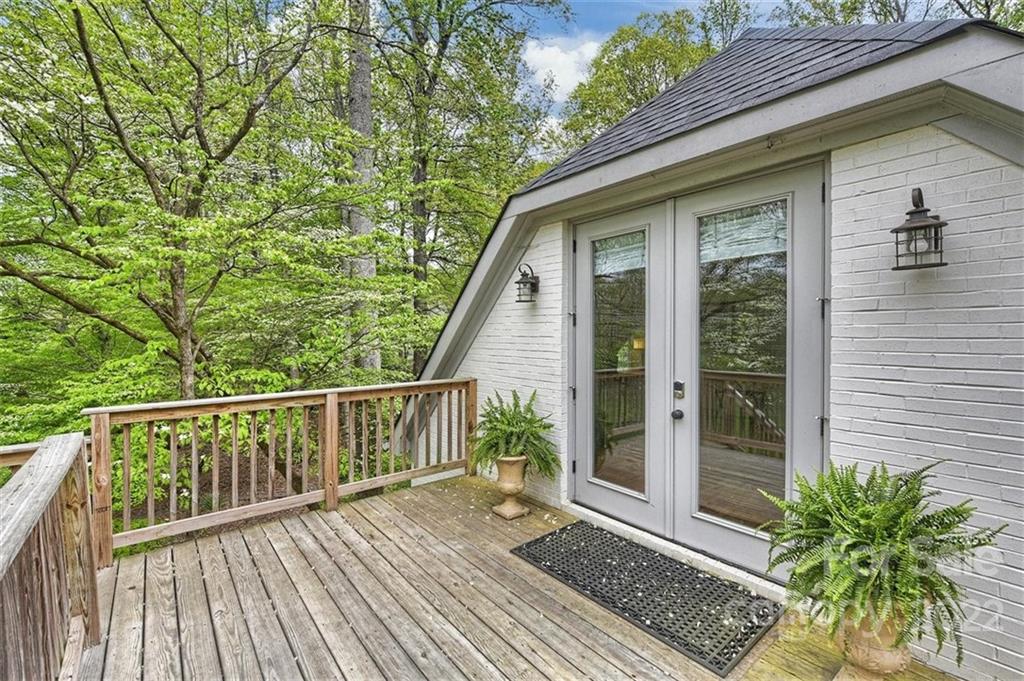 4023 Columbine Circle Charlotte, NC 28211 - Photo 32 of 35 a view of a wooden deck and a yard