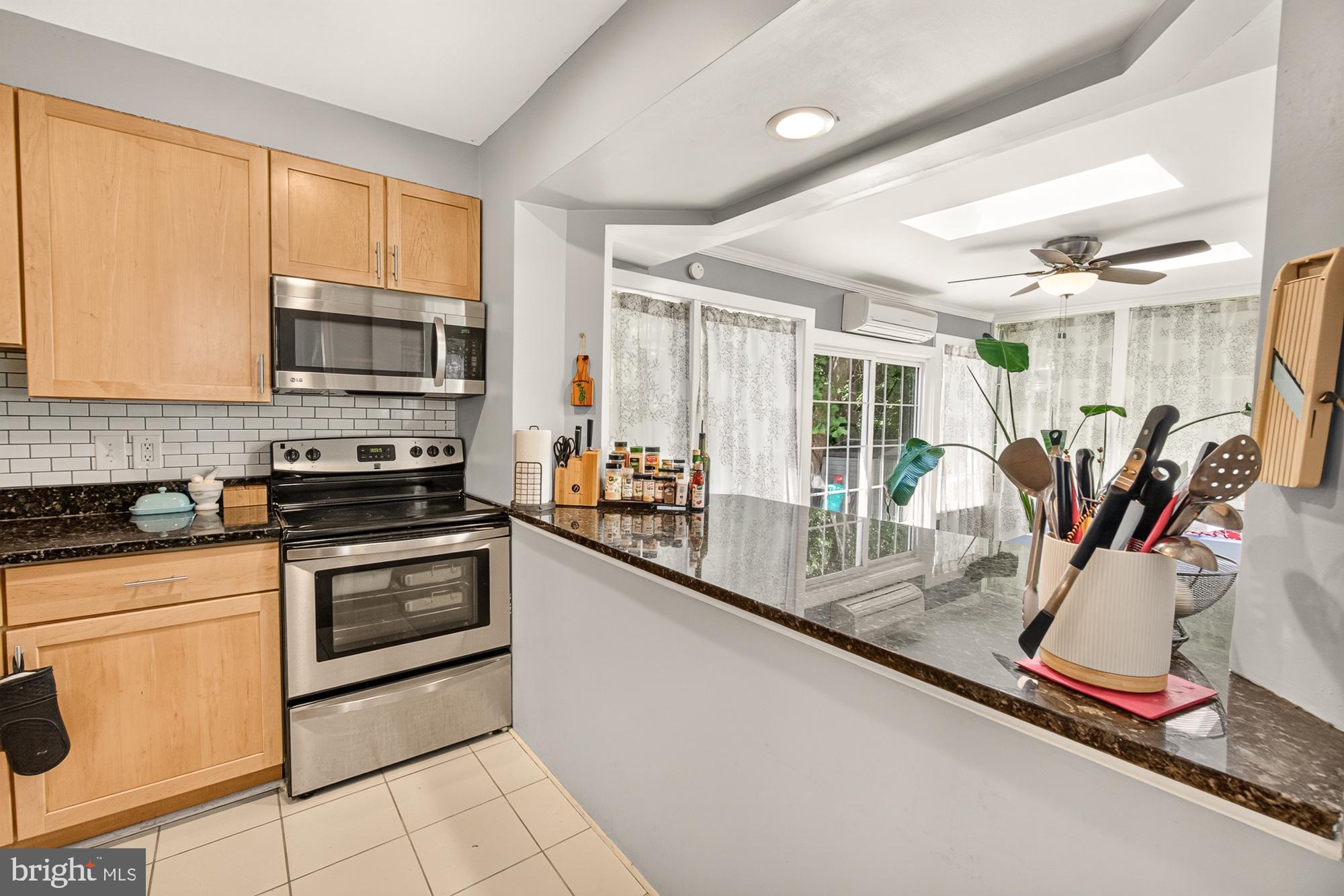 10202 Leslie Street Silver Spring, MD 20910 - Photo 13 of 44 Modern kitchen with sleek finishes.