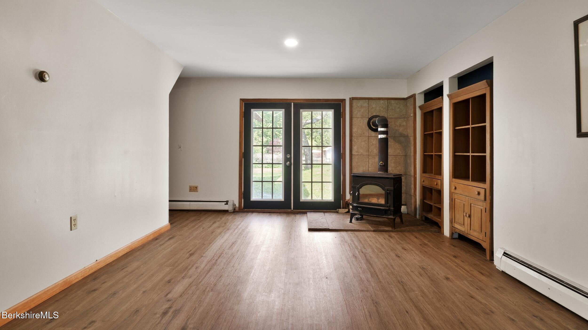 20 East Dugway Road Lenox, MA 01240 - Photo 31 of 84 an empty room with wooden floor and windows