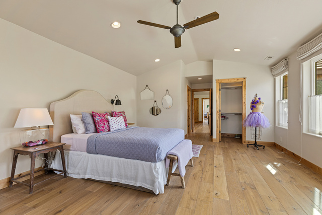 105 River Bend Circle, Unit 105 Springdale, UT 84767 - Photo 25 of 56 Vaulted ceiling bedroom with wood-finish flooring, two windows with window treatments, a ceiling fan, and recessed lighting