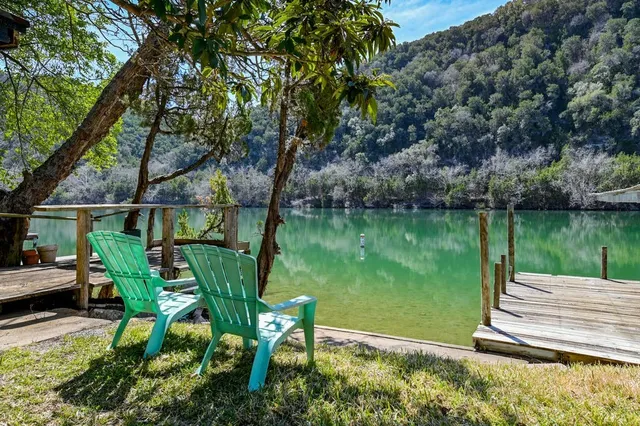 a view of a lake with a bench in a lake