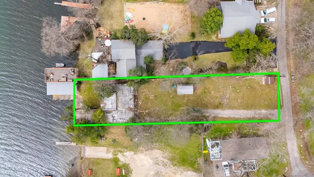 an aerial view of a house with a garden and a yard