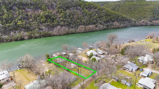 a view of a lake with a yard