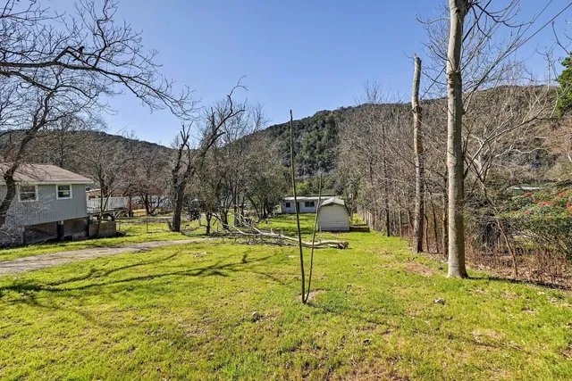 a view of a playground with basketball court
